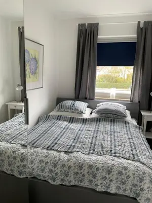 Ein Bett oder Betten in einem Zimmer der Unterkunft Hamptons No.4