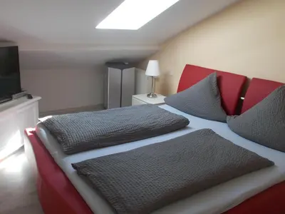 Ein Bett oder Betten in einem Zimmer der Unterkunft Gästehaus Strandkonsulat