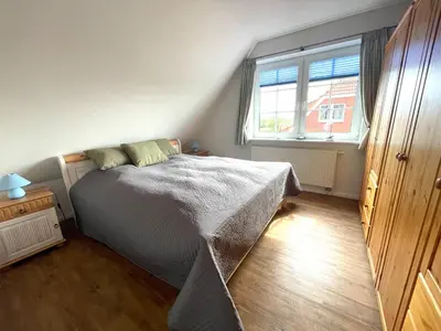 Ein Bett oder Betten in einem Zimmer der Unterkunft Die Ostseeperle mit Pool 2