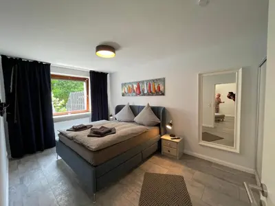 Ein Bett oder Betten in einem Zimmer der Unterkunft Ferienwohnung Gorch-Fock Scharbeutz