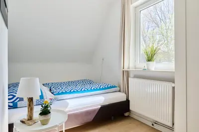 Ein Bett oder Betten in einem Zimmer der Unterkunft Ferienwohnung Trave Ufer Moba-Travel