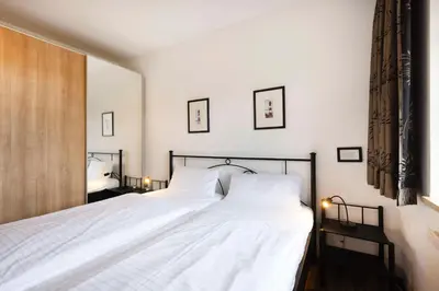 Ein Bett oder Betten in einem Zimmer der Unterkunft (DKK11B) Ferienwohnung Seegras