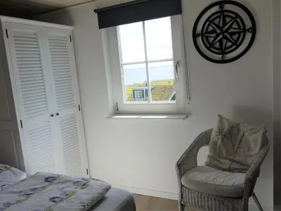 Ein Bett oder Betten in einem Zimmer der Unterkunft Ferienhaus Oceanview