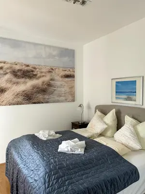 Ein Bett oder Betten in einem Zimmer der Unterkunft Strandperle Sonnenblick