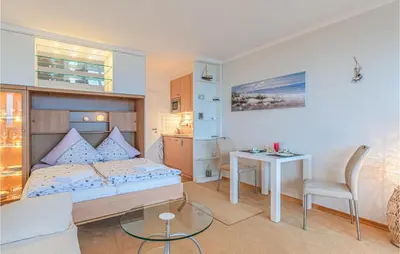Ein Bett oder Betten in einem Zimmer der Unterkunft Cozy Apartment In Timmendorfer Strand