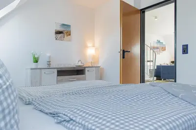 Ein Bett oder Betten in einem Zimmer der Unterkunft Ferienwohnung Ostseeherz Scharbeutz