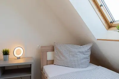Ein Bett oder Betten in einem Zimmer der Unterkunft Ferienwohnung Ostseeherz Scharbeutz
