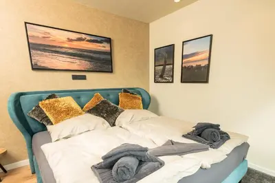 Ein Bett oder Betten in einem Zimmer der Unterkunft Heaven House Penthousewohnung Siebter Himmel
