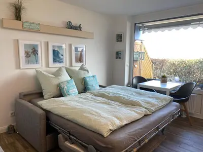 Ein Bett oder Betten in einem Zimmer der Unterkunft Stylische Ferienwohnung Scharbeutz TOP LAGE Strand