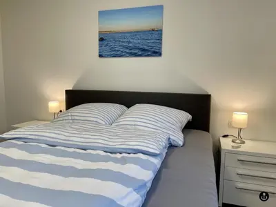 Ein Bett oder Betten in einem Zimmer der Unterkunft Neue Liebe Haffkrug 3