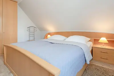 Ein Bett oder Betten in einem Zimmer der Unterkunft Fahrenkrug Nordlicht