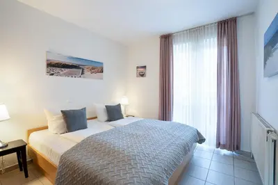 Ein Bett oder Betten in einem Zimmer der Unterkunft Gorch-Fock Park 2