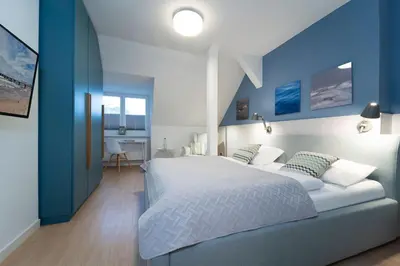Ein Bett oder Betten in einem Zimmer der Unterkunft Tanneneck Möwe