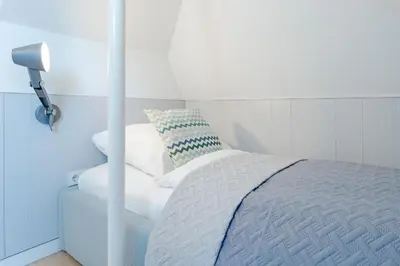 Ein Bett oder Betten in einem Zimmer der Unterkunft Tanneneck Möwe