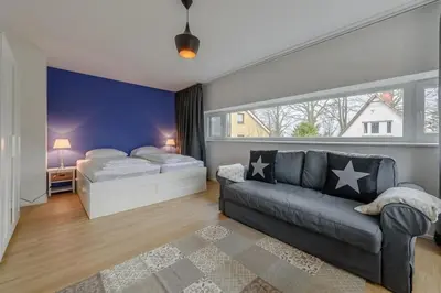 Ein Bett oder Betten in einem Zimmer der Unterkunft Fischerhuus Wohnung 3