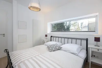 Ein Bett oder Betten in einem Zimmer der Unterkunft Fischerhuus Wohnung 1
