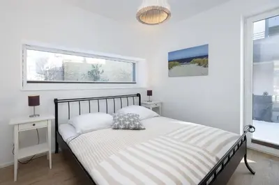 Ein Bett oder Betten in einem Zimmer der Unterkunft Fischerhuus Wohnung 1