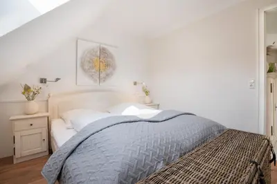 Ein Bett oder Betten in einem Zimmer der Unterkunft Haus Pegasus Auszeit am Meer