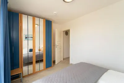 Ein Bett oder Betten in einem Zimmer der Unterkunft Hanseaten Residenz Seewolke
