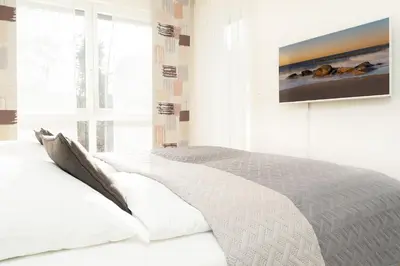 Ein Bett oder Betten in einem Zimmer der Unterkunft Strandvilla Augustusbad Morgenstern