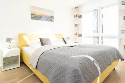 Ein Bett oder Betten in einem Zimmer der Unterkunft Strandvilla Augustusbad Morgenstern