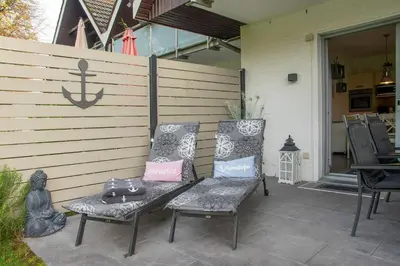Ein Patio oder anderer Außenbereich in der Unterkunft Badeweg 4 Haus Bullerbü- App 6