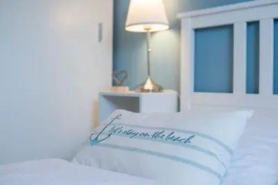 Ein Bett oder Betten in einem Zimmer der Unterkunft Badeweg 4 Haus Bullerbü- App 6
