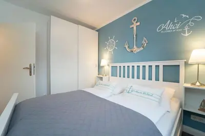 Ein Bett oder Betten in einem Zimmer der Unterkunft Badeweg 4 Haus Bullerbü- App 6