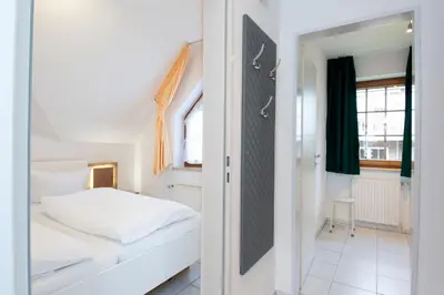 Ein Bett oder Betten in einem Zimmer der Unterkunft Alte Bergstraße 6 Dorschdüne