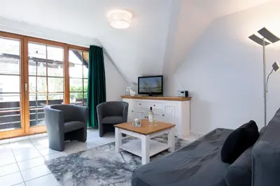 Ein Sitzbereich in der Unterkunft Alte Bergstraße 6 Dorschdüne