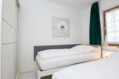 Ein Bett oder Betten in einem Zimmer der Unterkunft Alte Bergstraße 6 Sprottentraum