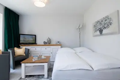 Ein Bett oder Betten in einem Zimmer der Unterkunft Alte Bergstraße 6 Schollenblick