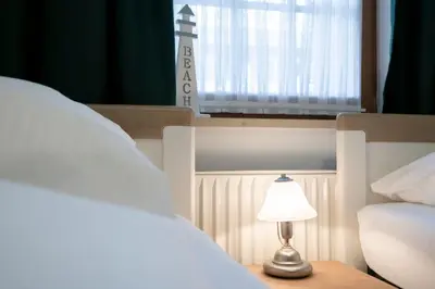 Ein Bett oder Betten in einem Zimmer der Unterkunft Alte Bergstraße 6 Heringsoase