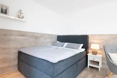 Ein Bett oder Betten in einem Zimmer der Unterkunft Seestraße 43 Strandbrise