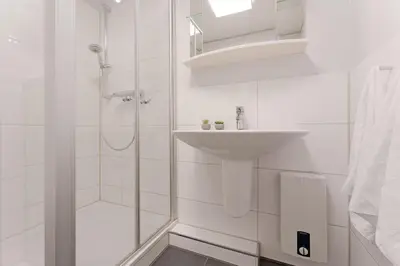 Ein Badezimmer in der Unterkunft Haus am Kurpark Scharbeutz Küstenstern