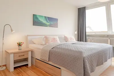 Ein Bett oder Betten in einem Zimmer der Unterkunft Nordlicht