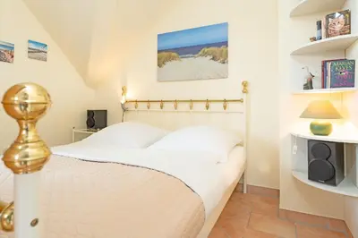 Ein Bett oder Betten in einem Zimmer der Unterkunft Seepark Küstenschimmer