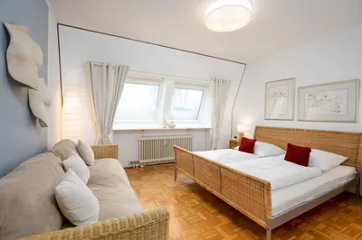 Ein Bett oder Betten in einem Zimmer der Unterkunft Ostseeperle