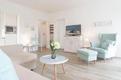 Ein Sitzbereich in der Unterkunft Haus Beau Rivage Strandbude