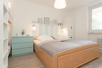 Ein Bett oder Betten in einem Zimmer der Unterkunft Haus Beau Rivage Strandbude
