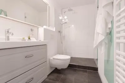Ein Badezimmer in der Unterkunft Haus Beau Rivage Strandbude