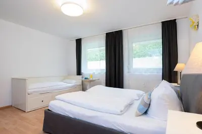 Ein Bett oder Betten in einem Zimmer der Unterkunft Alte Bergstraße 11 Wittdün 2