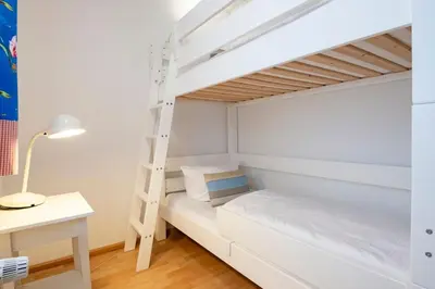 Ein Bett oder Betten in einem Zimmer der Unterkunft Alte Bergstraße 11 Wittdün 2