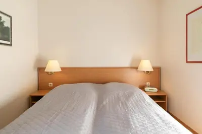 Ein Bett oder Betten in einem Zimmer der Unterkunft Witthus- Wohnung 2