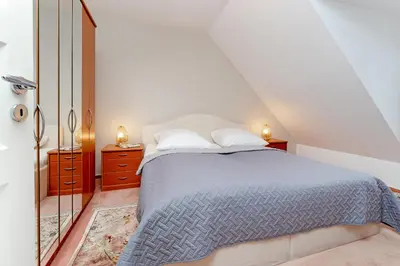Ein Bett oder Betten in einem Zimmer der Unterkunft Hansa-Residenz Wellenklang