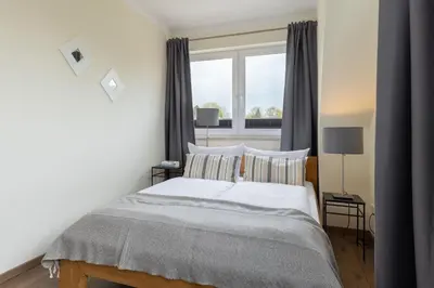 Ein Bett oder Betten in einem Zimmer der Unterkunft Baltic Sea Lodge Küstenidyll