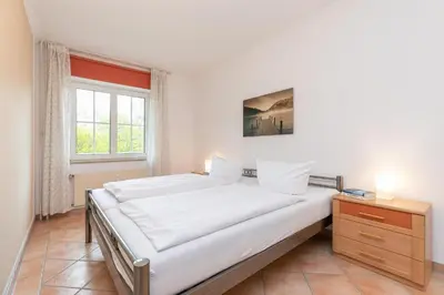 Ein Bett oder Betten in einem Zimmer der Unterkunft Seepark Wohnung 15