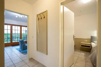 Ein Bett oder Betten in einem Zimmer der Unterkunft Schmiedestraße 3 Küstencharme