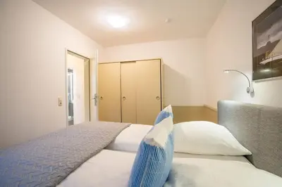 Ein Bett oder Betten in einem Zimmer der Unterkunft Schmiedestraße 3 Küstencharme
