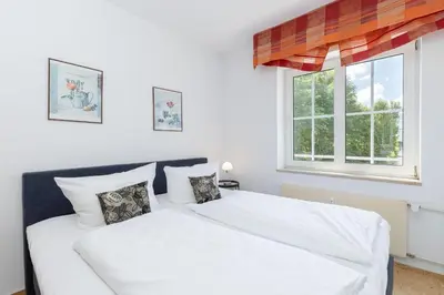 Ein Bett oder Betten in einem Zimmer der Unterkunft Seepark Wohnung 23